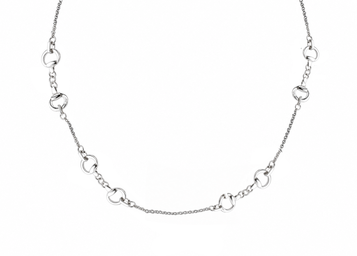 A silver-toned chain necklace featuring alternating horse snaffle bit charms